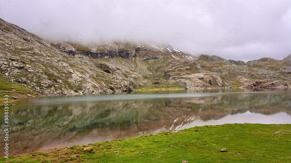 Pyrenean lake on cloudy day