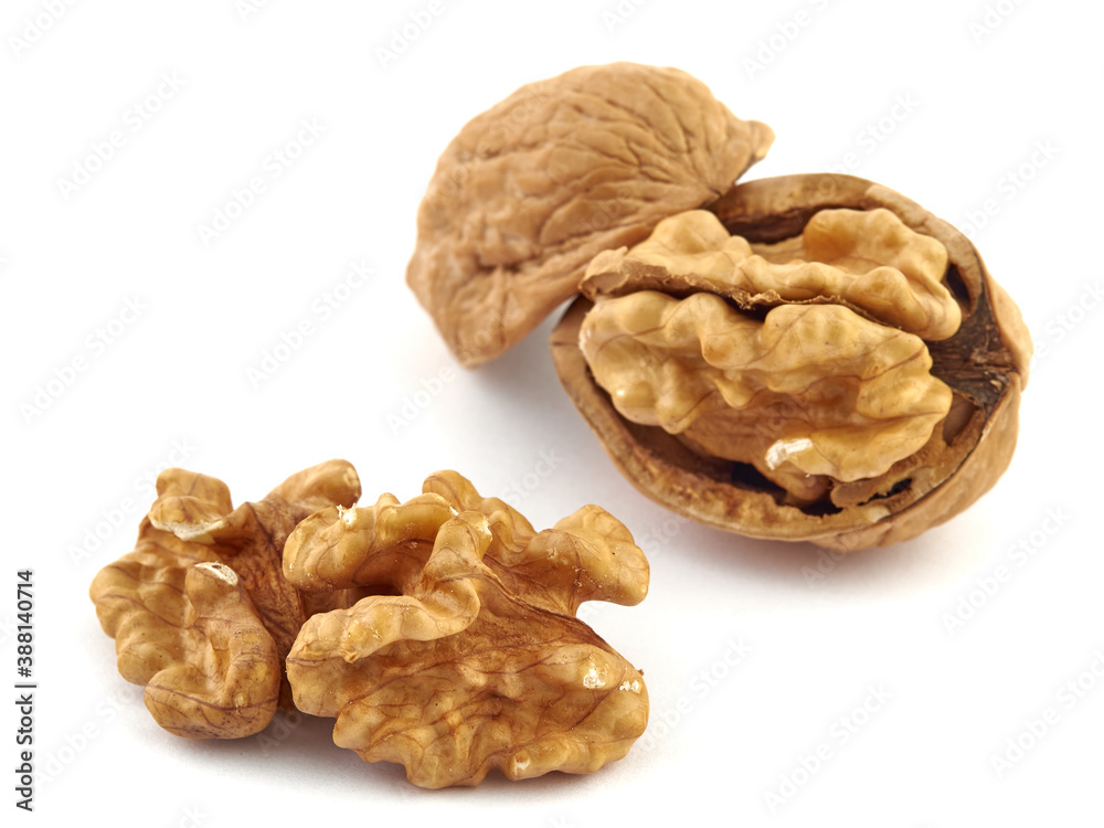 Walnuts and shells lie on a white background.Isolate Walnuts and shells lie on a white background.Isolate