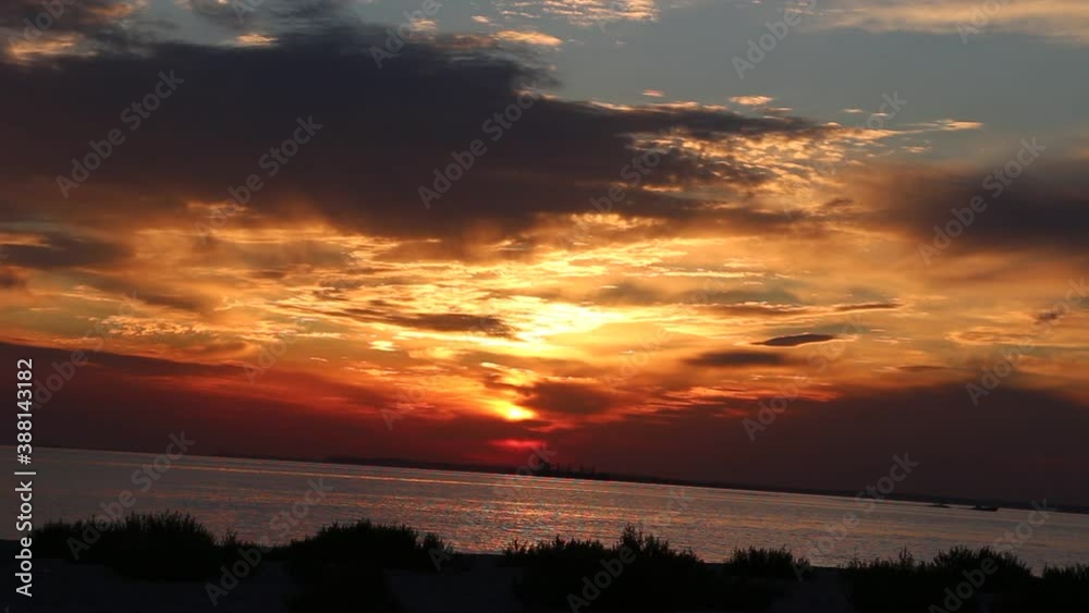 Dramatic sea sunrise. The golden sky and the clouds and the dark sea Dramatic sea sunrise. The golden sky and the clouds and the dark sea