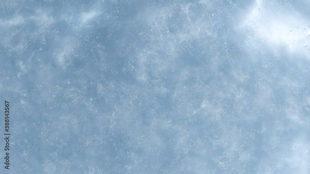 Super Slow Motion Shot of Glitters Glittering in Water on Blue Background at 1000 fps. Super Slow Motion Shot of Glitters Glittering in Water on Blue Background at 1000 fps.