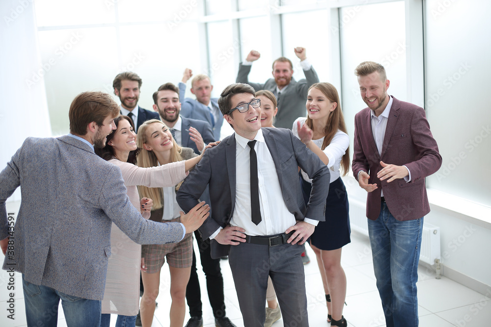 boss and the gleeful business team standing together boss and the gleeful business team standing together