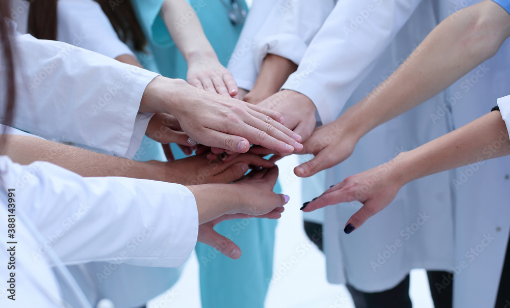 top view. a group of smiling doctors pointing at you. - obrazy, fototapety, plakaty 