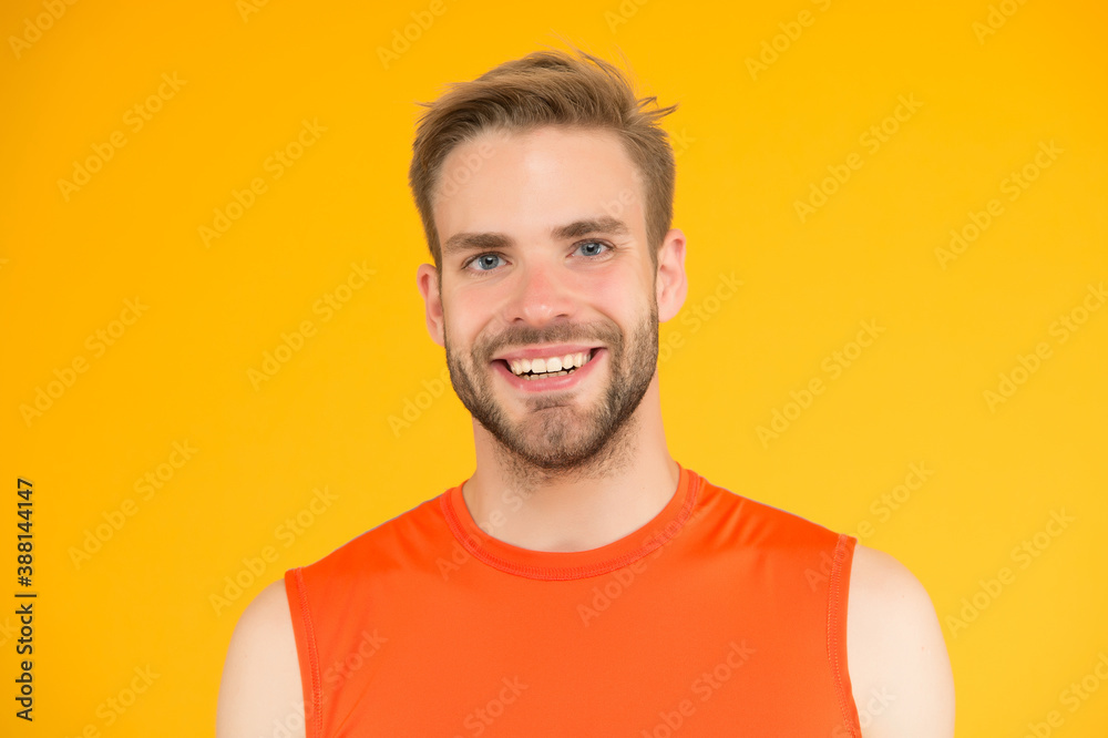 nice healthy smile. handsome young man with bristle. happy man with groomed hair. male beauty standard. guy casual style on yellow background. barbershop concept. sport and fitness fashion nice healthy smile. handsome young man with bristle. happy man with groomed hair. male beauty standard. guy casual style on yellow background. barbershop concept. sport and fitness fashion