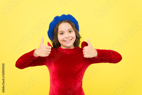 best day ever. trendy parisian child in red dress. smiling teenager wear elegant dress on yellow background. beauty and french fashion. retro kid fashion style. positive girl in vintage beret hat