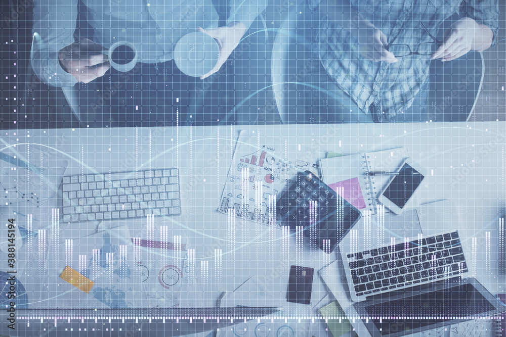 Double exposure of man and woman working together and financial chart hologram drawing. market analysis concept. Computer background. Top View. Double exposure of man and woman working together and financial chart hologram drawing. market analysis concept. Computer background. Top View.