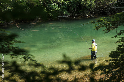 Man fly-fishing in Savinja river photo
