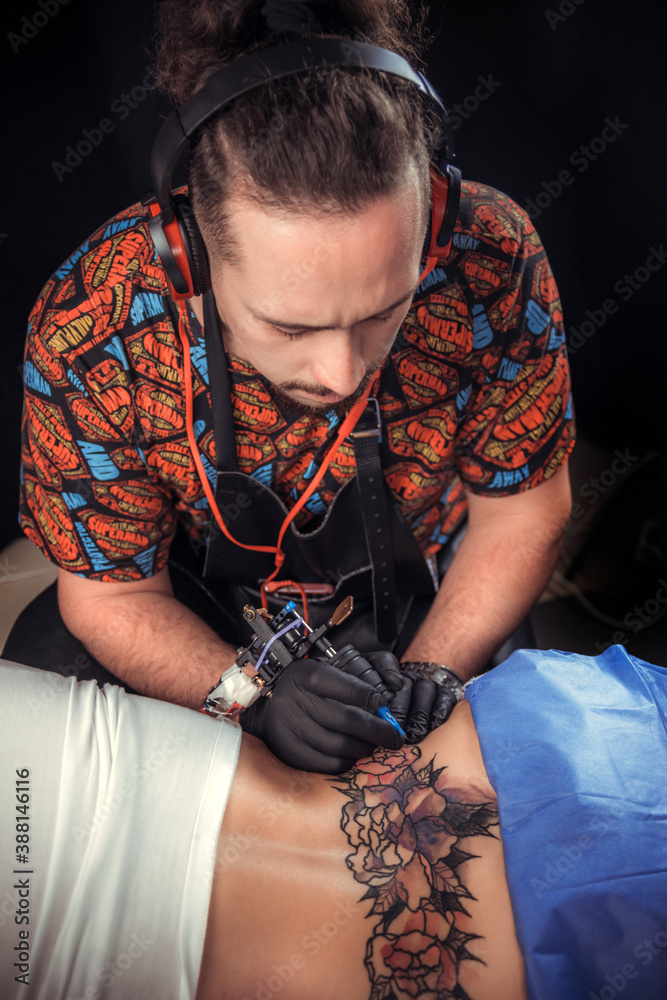 Tattoo artist designs a tattoo