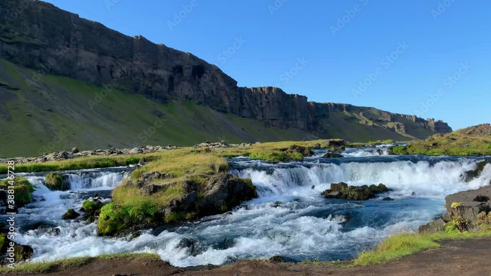 A clear river landscape with cascades and small waterfalls in rocky canyon, Iceland - (4K) A clear river landscape with cascades and small waterfalls in rocky canyon, Iceland - (4K)