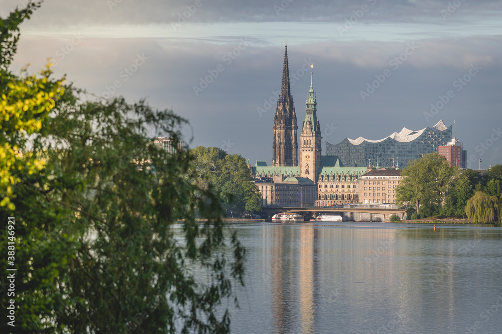 Germany, Hamburg, Town hall, Church of St. Nicholas and Elbphilharmonie seen across Outer Alster Lake Germany, Hamburg, Town hall, Church of St. Nicholas and Elbphilharmonie seen across Outer Alster Lake