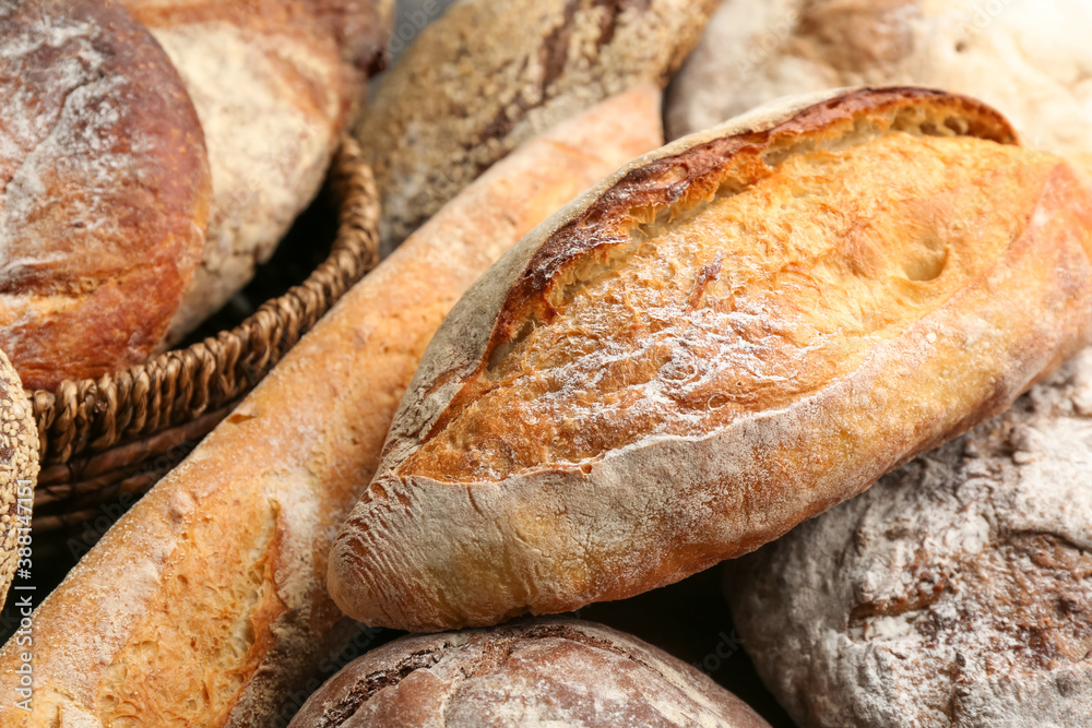 Different kinds of fresh bread as background, closeup