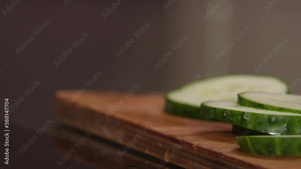 sliced cucumbers lie on the board in the kitchen sliced cucumbers lie on the board in the kitchen