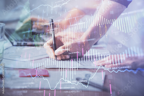 Multi exposure of woman hands typing on computer and financial chart hologram drawing. Stock market analysis concept. © peshkova