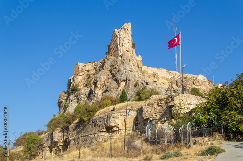 Mardin Castle and Turkish flag view. Old Mardin, Turkey