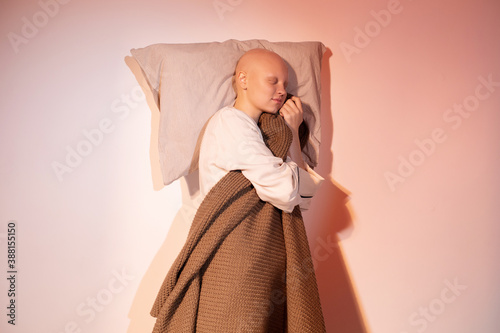 Sleeping hairless model with pillow and plaid photo