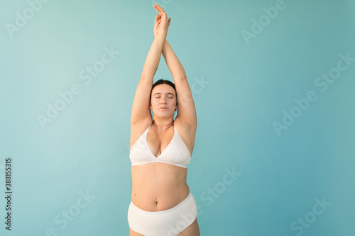 Plus size model with raised arms photo