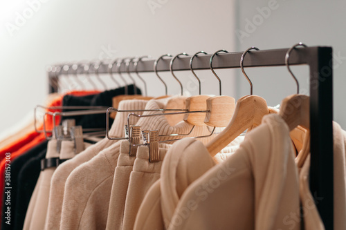 Rack with trendy clothes in store photo