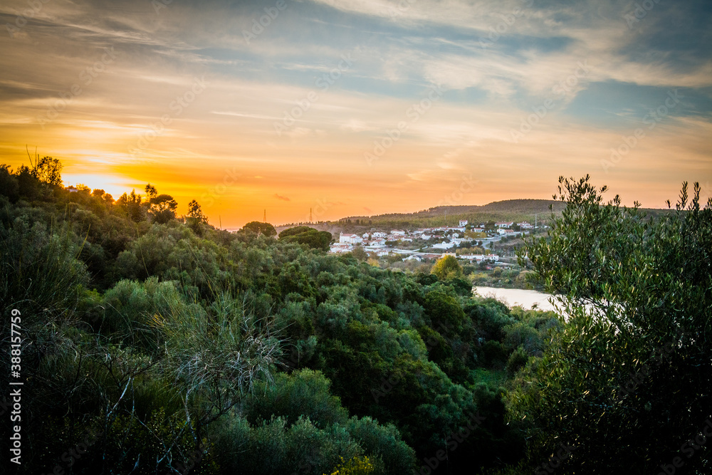 Autumn sunset in the hills over the river. River Tagus in Portugal