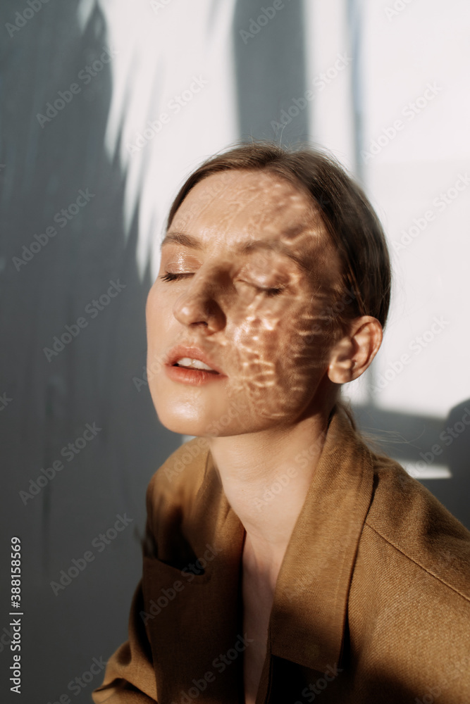 Female model with reflection of water on face Female model with reflection of water on face