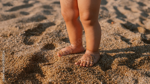 Toddler feet on the sand photo