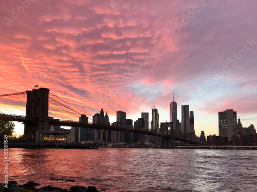 A vibrant sunset view of the New York skyline photo