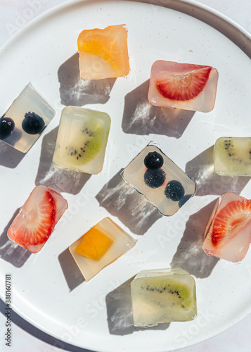 Japanese fruit jellies with fresh fruit on ceramic plate photo