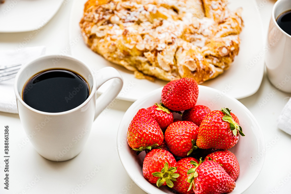 cup of coffee with strawberries and croissant cup of coffee with strawberries and croissant
