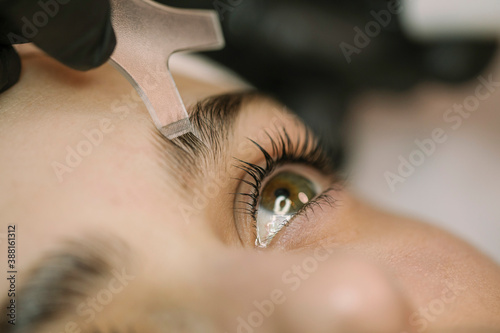 Young Woman Getting Natural Lash and Brows treatment photo