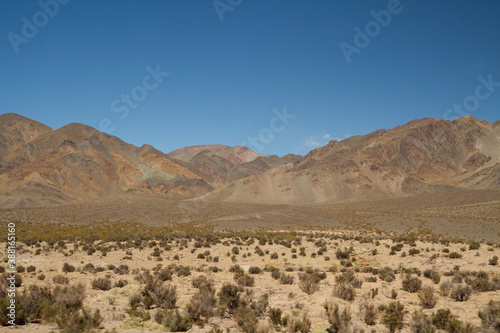 The Andes mountain range. View arid desert, rock and sandstone mountains under a blue sky.