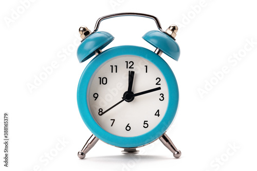 old blue alarm clock isolated on a white background. copy space. studio shot. time symbol. schedule concept