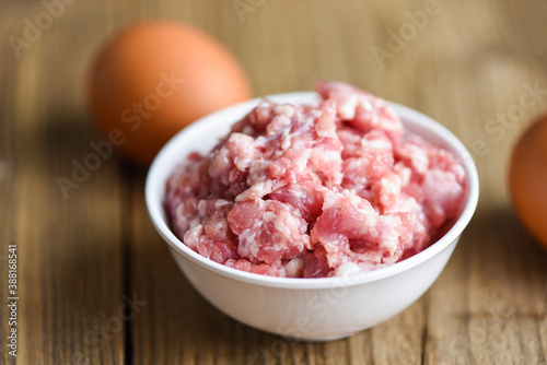 Mincemeat , minced or ground meat / Raw pork on bowl with egg Ground Pork