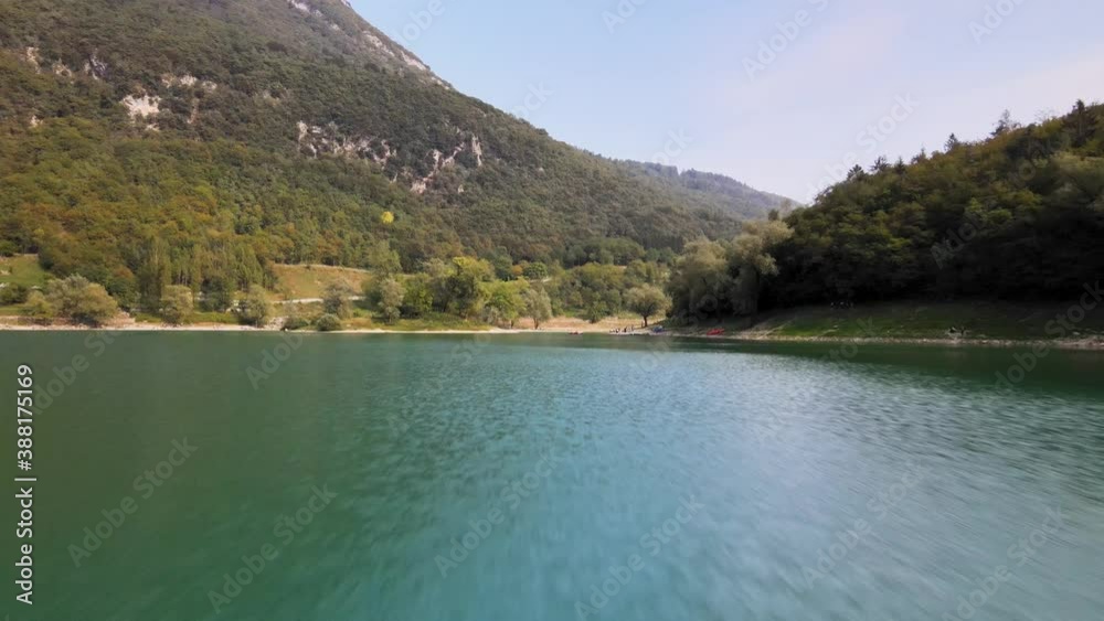 Aerial View of Lago di Tenno, Trentino Province, North Italy. Flying Above Green Water on Sunny Summer Day Aerial View of Lago di Tenno, Trentino Province, North Italy. Flying Above Green Water on Sunny Summer Day