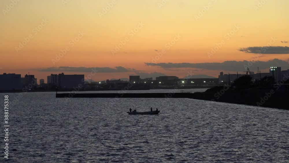 People fishing in Tokyo Bay in the evening People fishing in Tokyo Bay in the evening