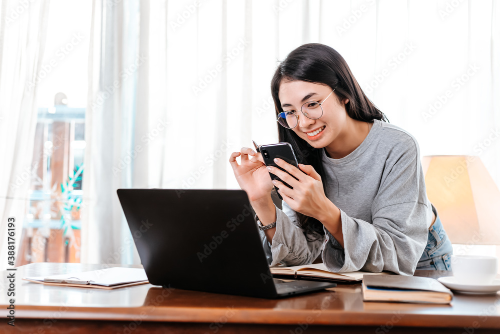woman using mobile phone while working at home. Businesswoman working concept. woman using mobile phone while working at home. Businesswoman working concept.