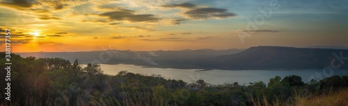 Panorama Beautiful sunset over lake at Lam Ta Khong Reservoir, Nakhon Ratchasima province, Thailand. © Lab_Photo