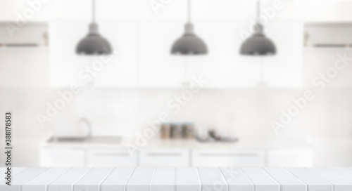 Empty white wooden top table with blurred background of kitchen room. photo