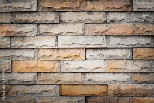 gray orange brick wall texture grunge background with vignette corners