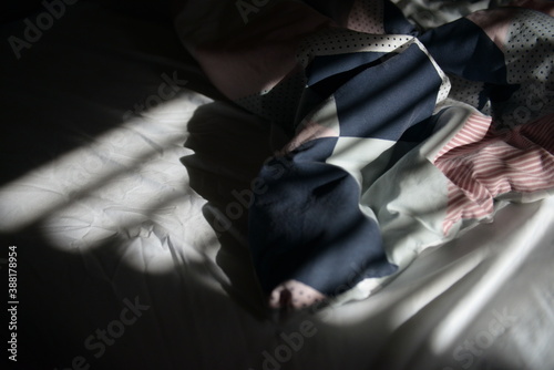 The bedsheet and lines in the light in the bedroom © Natalie