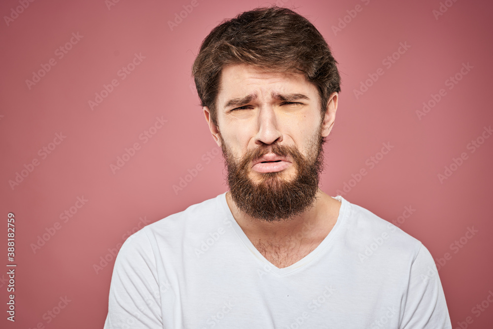 emotional man white t shirt sad facial expression pink background emotional man white t shirt sad facial expression pink background