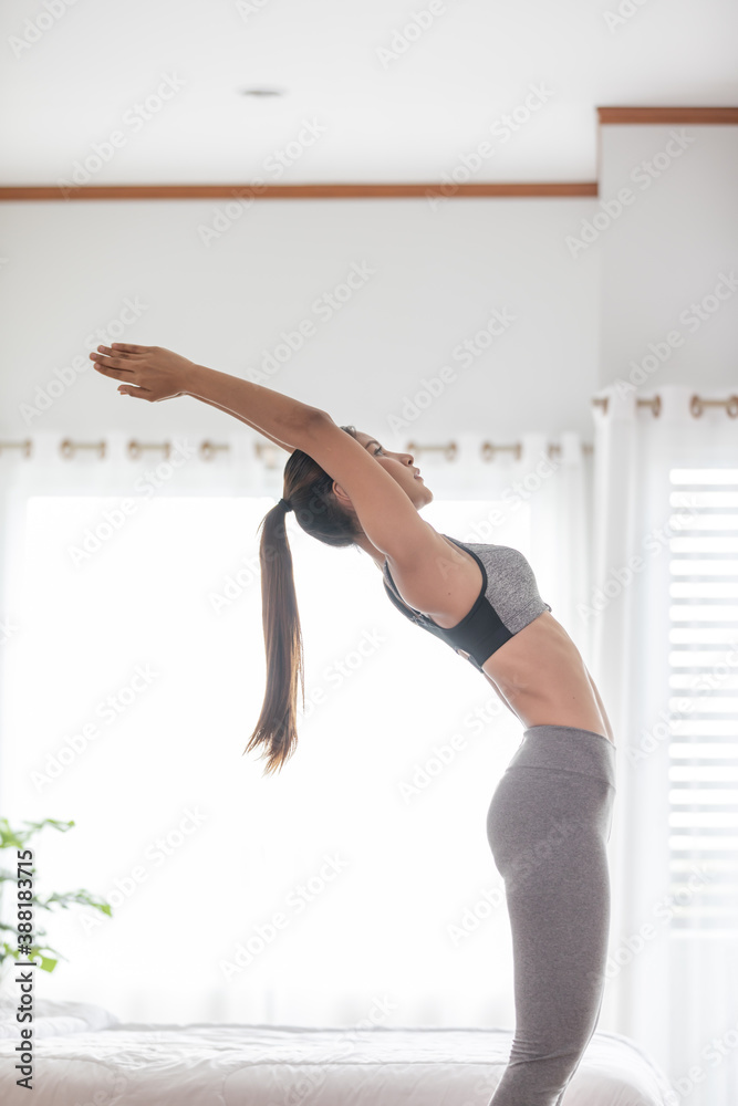 Athletic Healthy Asian indian woman in sportswear workout excercise at home in bedroom,Young woman with slim body cardio aerobic exercises healthy lifestyle concept Athletic Healthy Asian indian woman in sportswear workout excercise at home in bedroom,Young woman with slim body cardio aerobic exercises healthy lifestyle concept