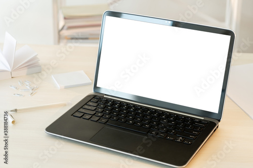 Laptop blank screen. Remote job. Office workspace. Digital technology. Portable computer with white display on table light interior background copy space.