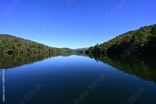 Fototapeta Naklejka Na Ścianę i Meble -  Autumn landscape reflections on Lake Santeetlah, North Carolina.