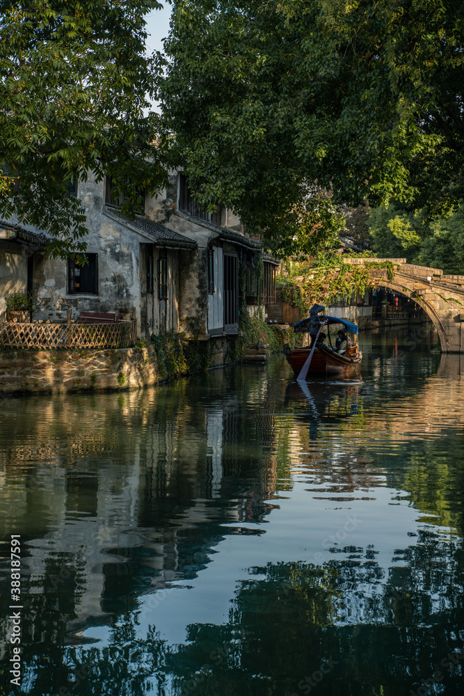 The sunrise view of the architectures and rivers in Zhouzhuang, a ancient Chinese village in Jiangsu, China. The sunrise view of the architectures and rivers in Zhouzhuang, a ancient Chinese village in Jiangsu, China.