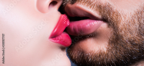 Man with woman kisses. Close up of couple lips wants to kiss. photo