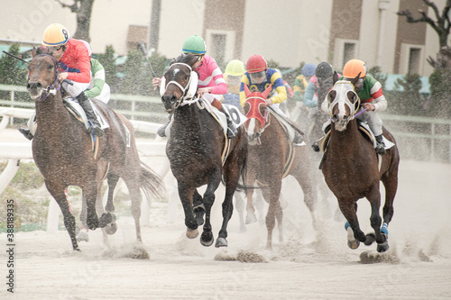 competitive horse racing in heavy sandstorm with light tone.