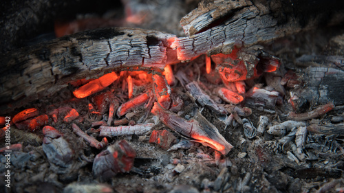 Fire with coals in the fire. Open fire, dying embers. Beautiful rich colors.