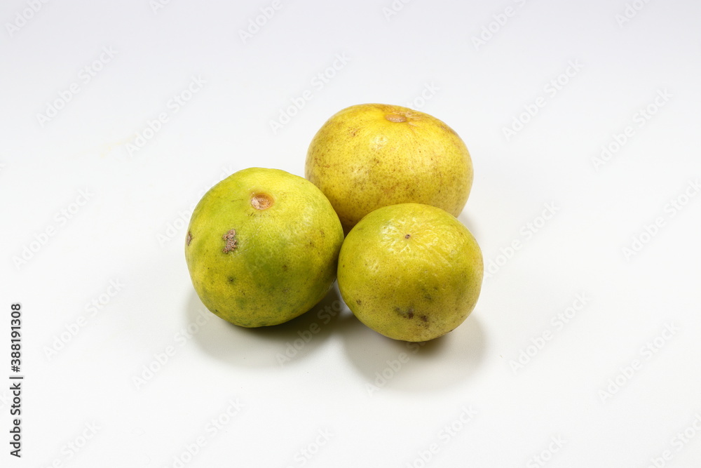 Pile of fresh and organic ripe lime isolated on the white background. Famous tropical ingredients in Asia restaurant. Juicy with high vitamin C and sour tasty. Pile of fresh and organic ripe lime isolated on the white background. Famous tropical ingredients in Asia restaurant. Juicy with high vitamin C and sour tasty.