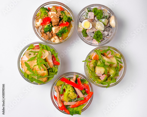 Healthy food - mix vegetable salad served in a bowl over white background. Healthy eating, delicious snack or dinner.