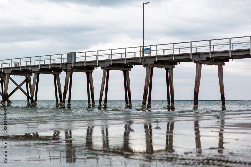 The largs bay jetty with its reflection in the foreground in adelaide south australia on october 26th 2020