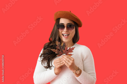 Happy young woman with autu...