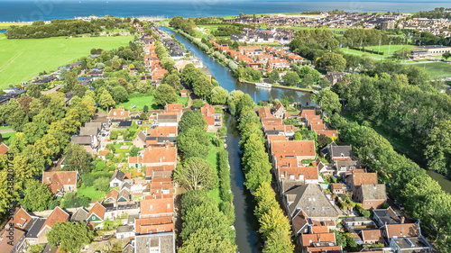 Aerial drone view of Edam town cityscape from above, typical Dutch city skyline with canals, houses and marina, Holland, Netherlands
 photo